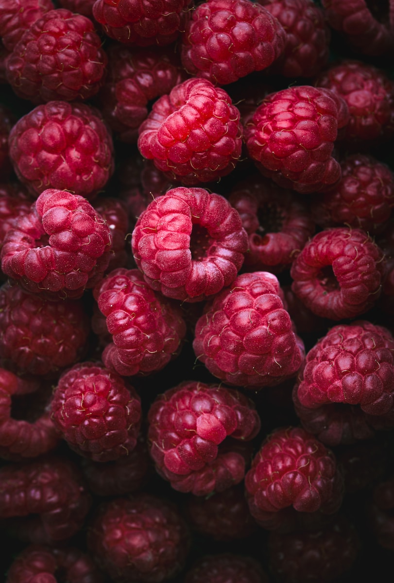 a bunch of raspberries sitting on top of each other